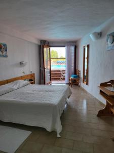 Postel nebo postele na pokoji v ubytování Hotel Olimpia + 37 fotografií