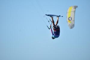 a man is doing a trick on a windsurfing at Pousada farol in Areia Branca +29 photos
