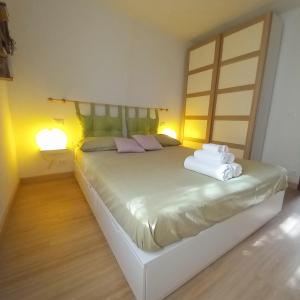 A bed or beds in a room at La casetta di Mizar