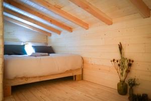 Postel nebo postele na pokoji v ubytování Au coeur de nos bois