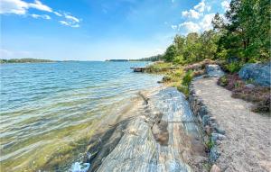 a large body of water with a rocky shoreline at Amazing Home In Gamleby With Kitchen in Gamleby