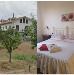 a bedroom with a bed and a tree in front of a house at Affittacamere Albafiorita in Castiglione dʼOrcia