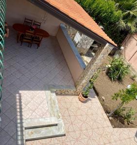 an overhead view of a patio with a table and chairs at Gorgo House in Lascari