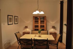 a dining room with a table and chairs at Ferienwohnung-Stricker-Bad-Sachsa in Bad Sachsa