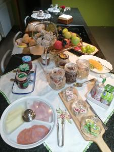 a table topped with plates of food on a table at TERRENO DAS MIMOSAS in Aveiro