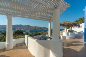 a white pergola with a view of the ocean at Hidden Oasis Private Villa in Agia Marina