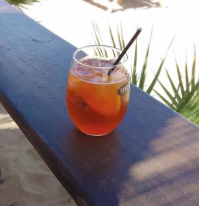 a drink in a glass sitting on a table at Ammos Residence in Minia