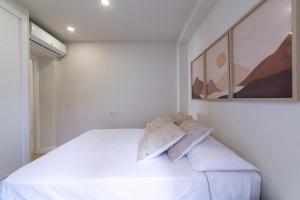 A bed or beds in a room at Edificio México