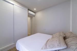 A bed or beds in a room at Edificio México