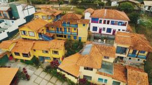 an overhead view of a group of houses with orange roofs at Pousada Aconchego da Valdirene in Lavras Novas