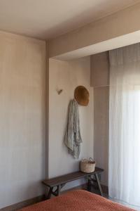 a bedroom with a bed and a shelf and a window at Azenhas do Mar Valley House in Sintra