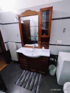 a bathroom with a sink and a mirror at CasaVacanze Salza nel Borgo in Sutri +36 photos