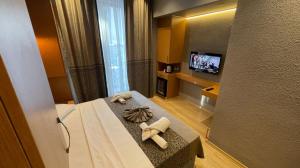 A television and/or entertainment centre at Grand Ambiance Hotel