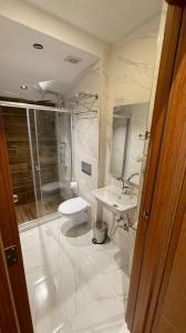 A bathroom at Grand Ambiance Hotel