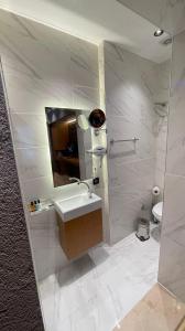 A bathroom at Grand Ambiance Hotel
