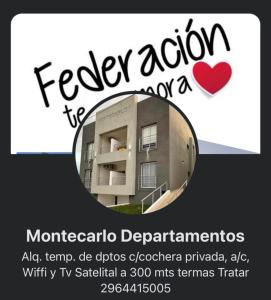 een bord voor een appartementencomplex met een spiegel bij Edif Montecarlo I En PB, a mts de las Termas in Federación