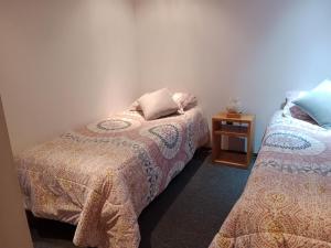 Una cama o camas en una habitación de ALMER HOSTAL