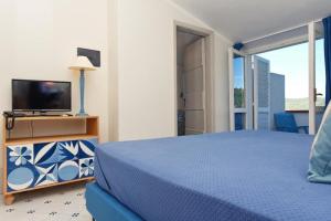 Postel nebo postele na pokoji v ubytování Hotel Garden Riviera