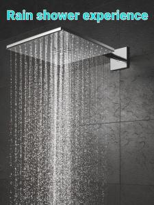 a shower experience with a rain shower experience at Cazare SPORT CONFORT in Hunedoara