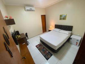 Postel nebo postele na pokoji v ubytování Bertolini Hotel