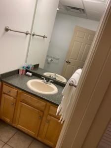 a bathroom with a sink and a mirror at Pershing Heights 201 in New Kensington