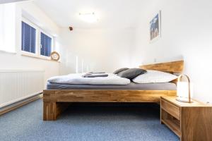 Posteľ alebo postele v izbe v ubytovaní Apartmány nad Šlikovkou