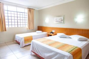 Postel nebo postele na pokoji v ubytování Vila Verde Hotel