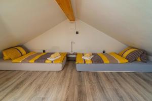 Postel nebo postele na pokoji v ubytování APARTMÁNY POD SJEZDOVKOU