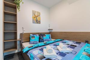 Postel nebo postele na pokoji v ubytování APARTMÁNY POD SJEZDOVKOU