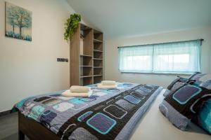 Postel nebo postele na pokoji v ubytování APARTMÁNY POD SJEZDOVKOU