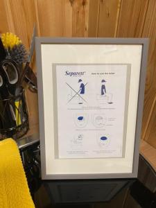 a framed picture of a person on skis at Couston Lakes Resorts in Bathgate