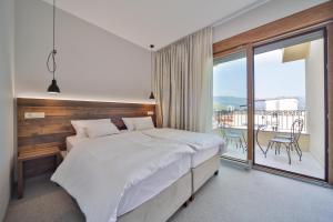 Voodi või voodid majutusasutuse Hotel Vladimir toas