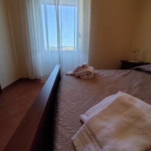 Postel nebo postele na pokoji v ubytování Casa vacanze la Morgia