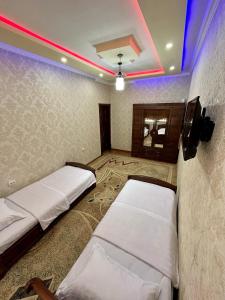 Ένα ή περισσότερα κρεβάτια σε δωμάτιο στο Samarkand luxury apartment #2