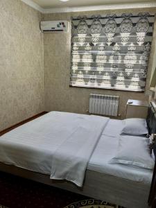 Ένα ή περισσότερα κρεβάτια σε δωμάτιο στο Samarkand luxury apartment #2