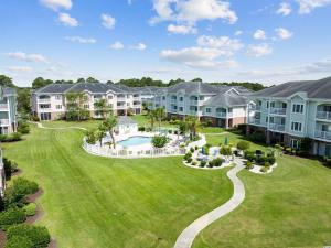an aerial view of a large yard with houses at Stunning Condo on Golf Course Near Broadway at the Beach in Myrtle Beach