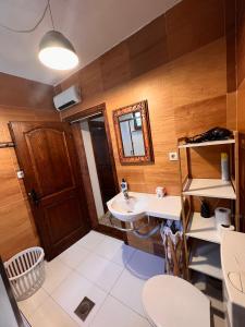 a bathroom with a sink and a mirror at Apartments Rux de Luxe in Bar