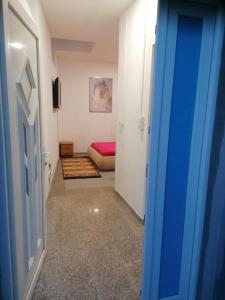 a hallway with a room with a bed and a door at Sphinx Apartment in Visoko +7 photos