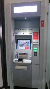 a atm machine with a sign on it at Alsfelder Apartment I in Alsfeld
