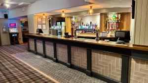 a bar in a hotel room with a counter at The Hoptimist in Stockton-on-Tees