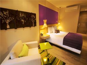 Ένα ή περισσότερα κρεβάτια σε δωμάτιο στο Hotel Bari Bucaramanga