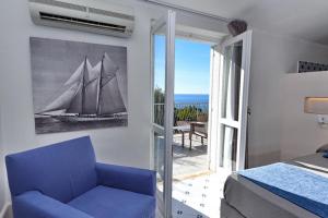 Postel nebo postele na pokoji v ubytování Hotel Garden Riviera