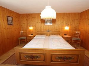 A bed or beds in a room at Ferienhaus Türtscher 2