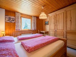 Postel nebo postele na pokoji v ubytování Ferienhaus Türtscher 1