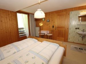 A bed or beds in a room at Ferienhaus Türtscher 2