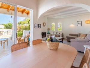 a living room with a table and a couch at Scenic Villa, Costa Blanca in Denia