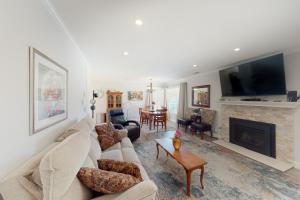 a living room with a couch and a fireplace at Portola Oasis in Monterey