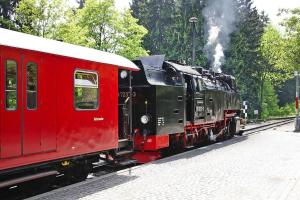 a red and black train is on the tracks at Apartments home Historischer Bahnhof Drei Annen Hohne - DMG03068-CYA in Drei Annen Hohne