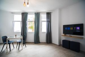 TV a/nebo společenská místnost v ubytování Casa Raquel