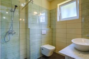 a bathroom with a shower and a toilet and a sink at Rooms with a parking space Mali Losinj (Losinj) - 3445 in Mali Lošinj